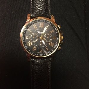 Black and gold leather watch